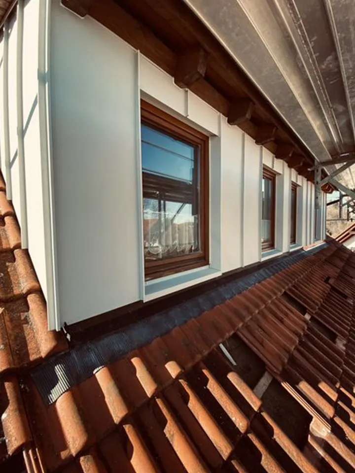 Dachdecker-Zimmerer-Baumann-Fassadengestaltung-Fassade2